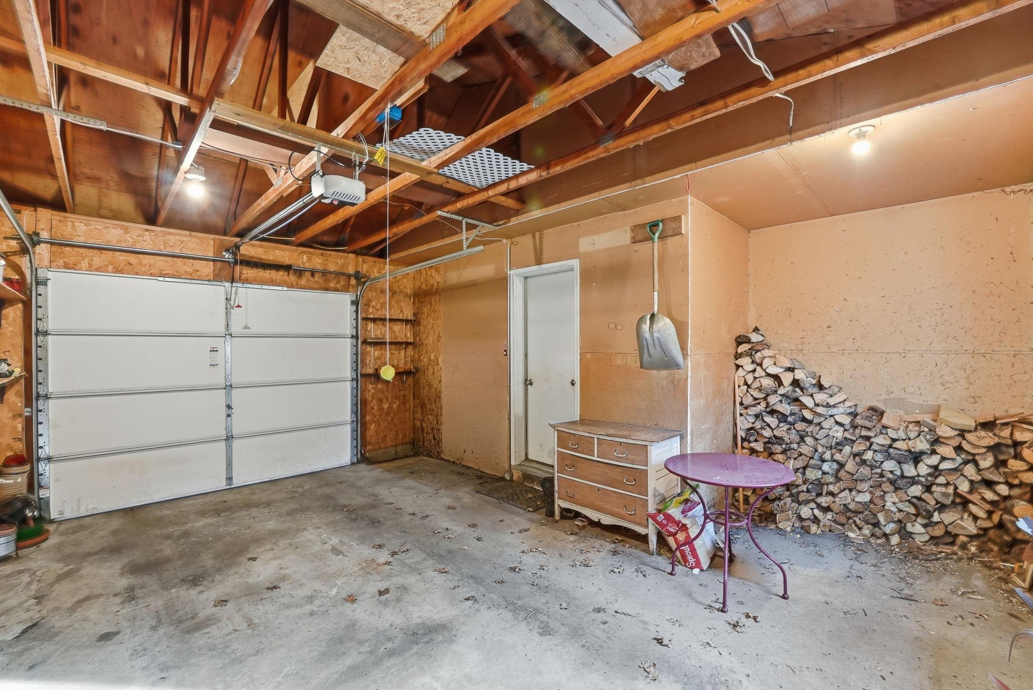 Single Stall Attached Garage with Storage for Firewood