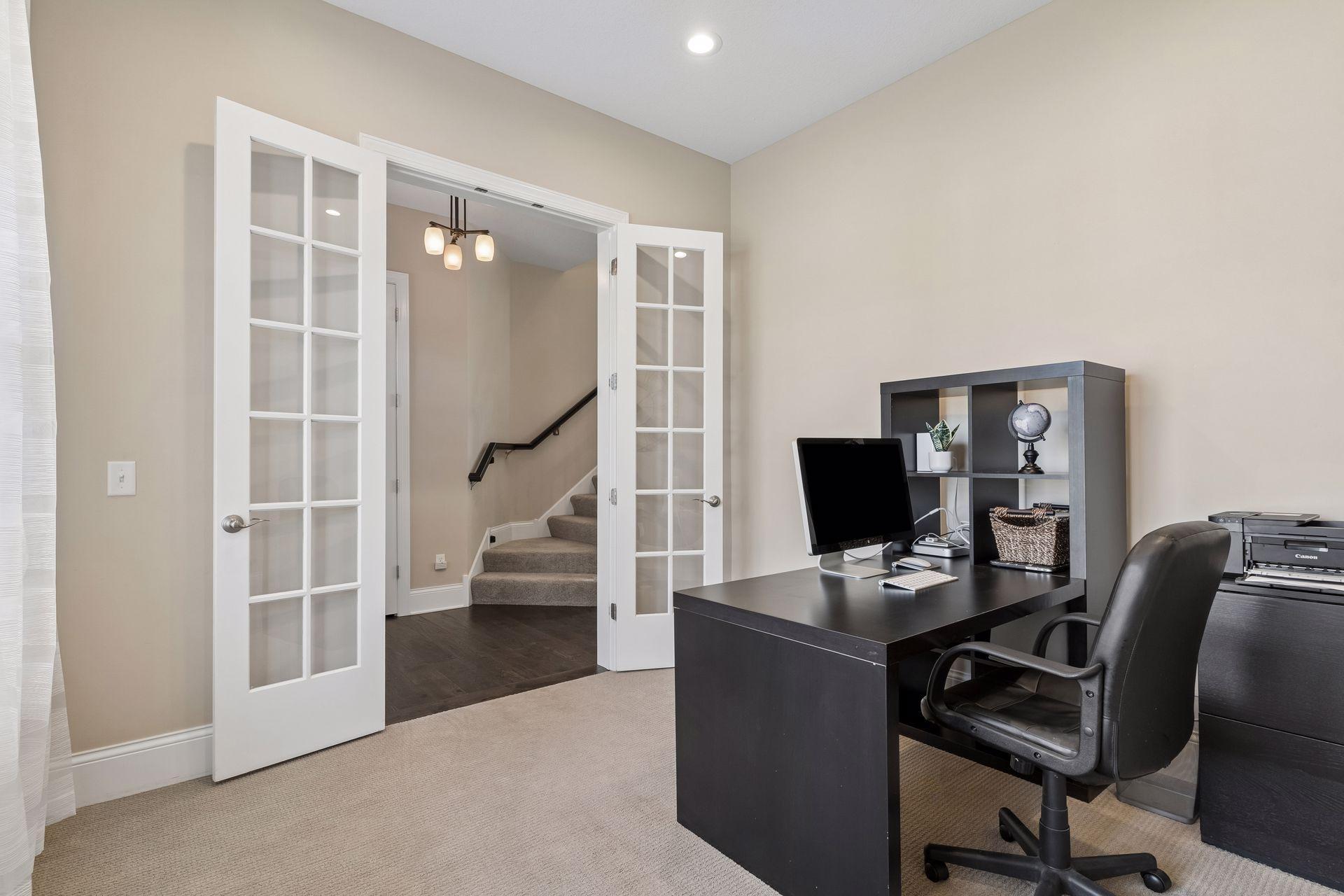 French doors close it off for private work meetings.