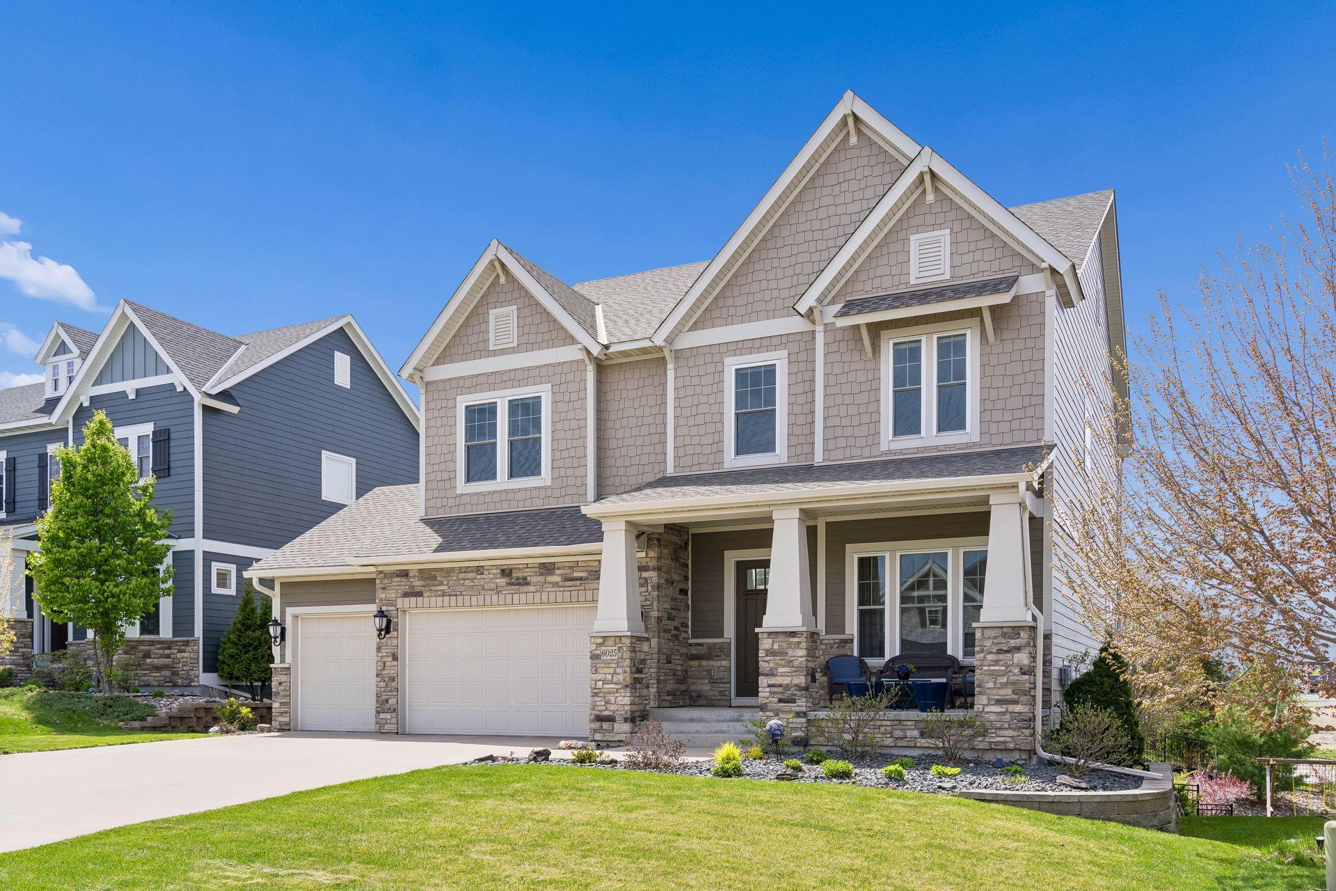 A front porch that is so inviting. A home with seamless gutters, an irrigation system, and epoxy flooring (already installed so you don't have to).