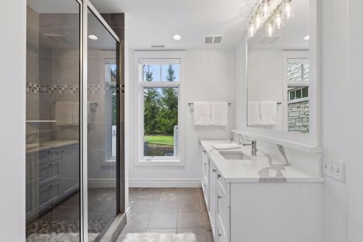 En-suite bathroom in the lower level with a walk-in shower