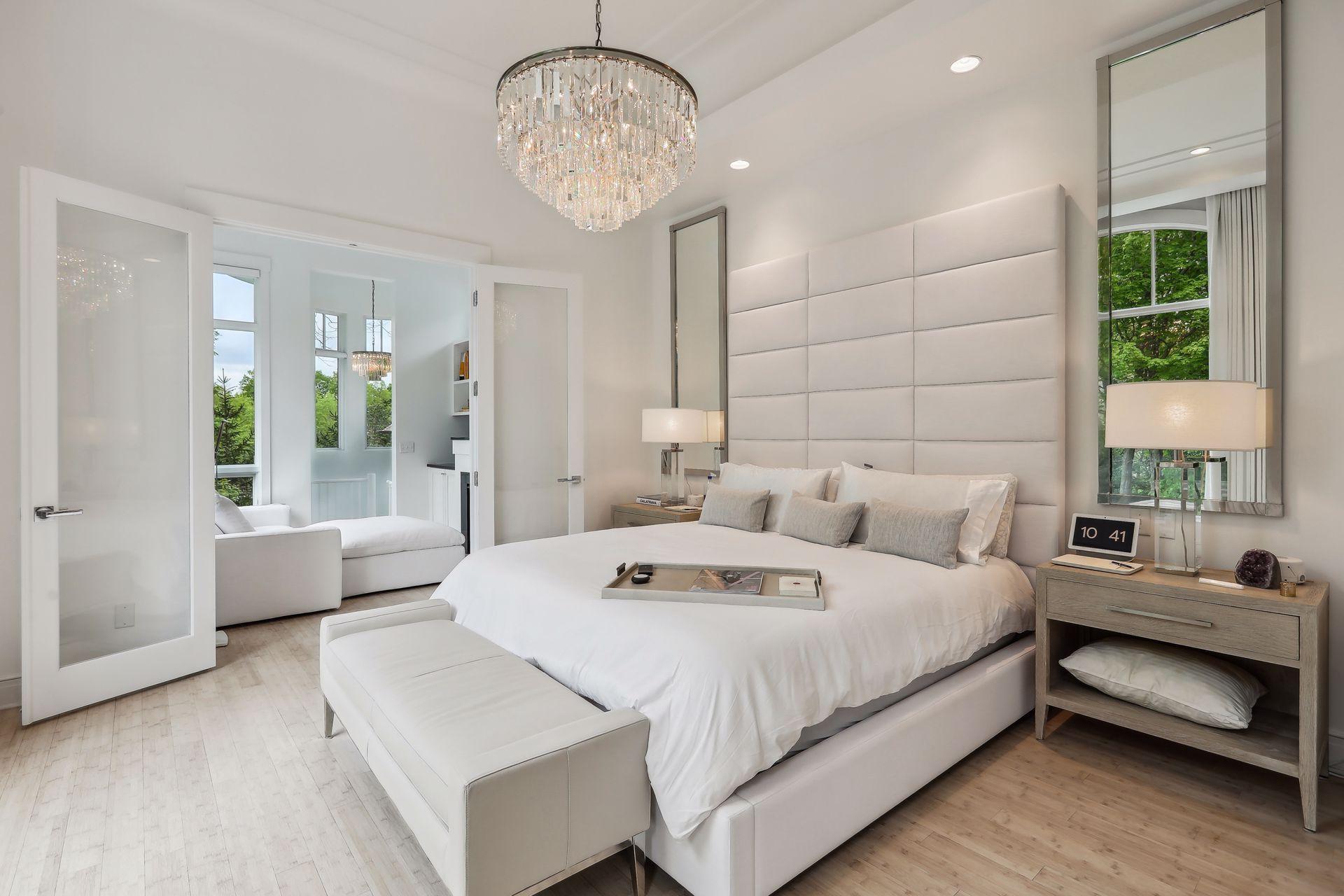 Retreat to the luxurious primary suite with access to the sitting room with fireplace.