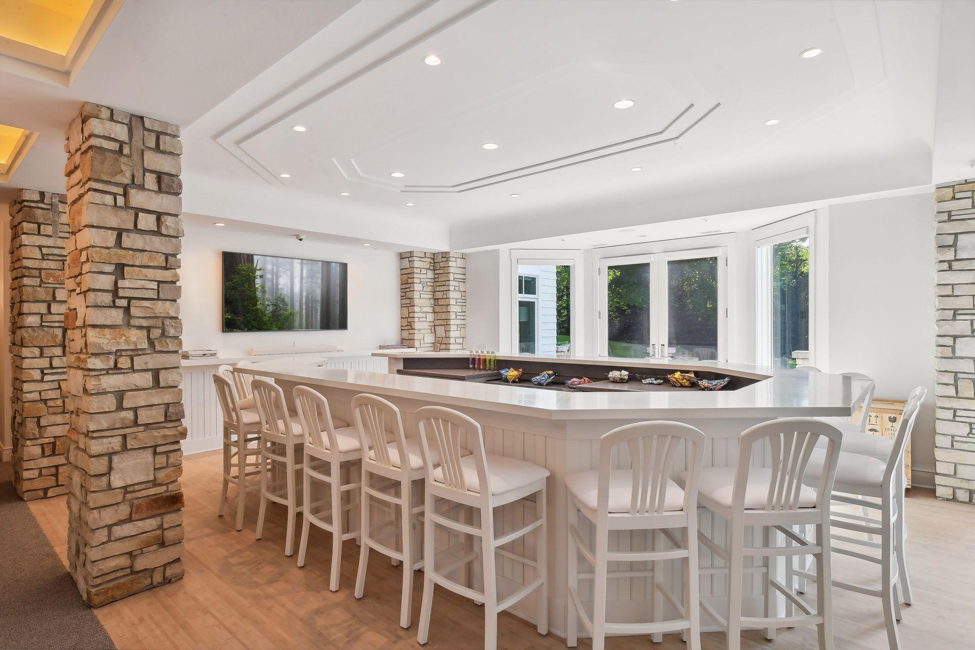 Head down to the lower level which is an entertainers dream. Impressive oversized bar with abundant seating, perfect for hosting game nights or casual gatherings.