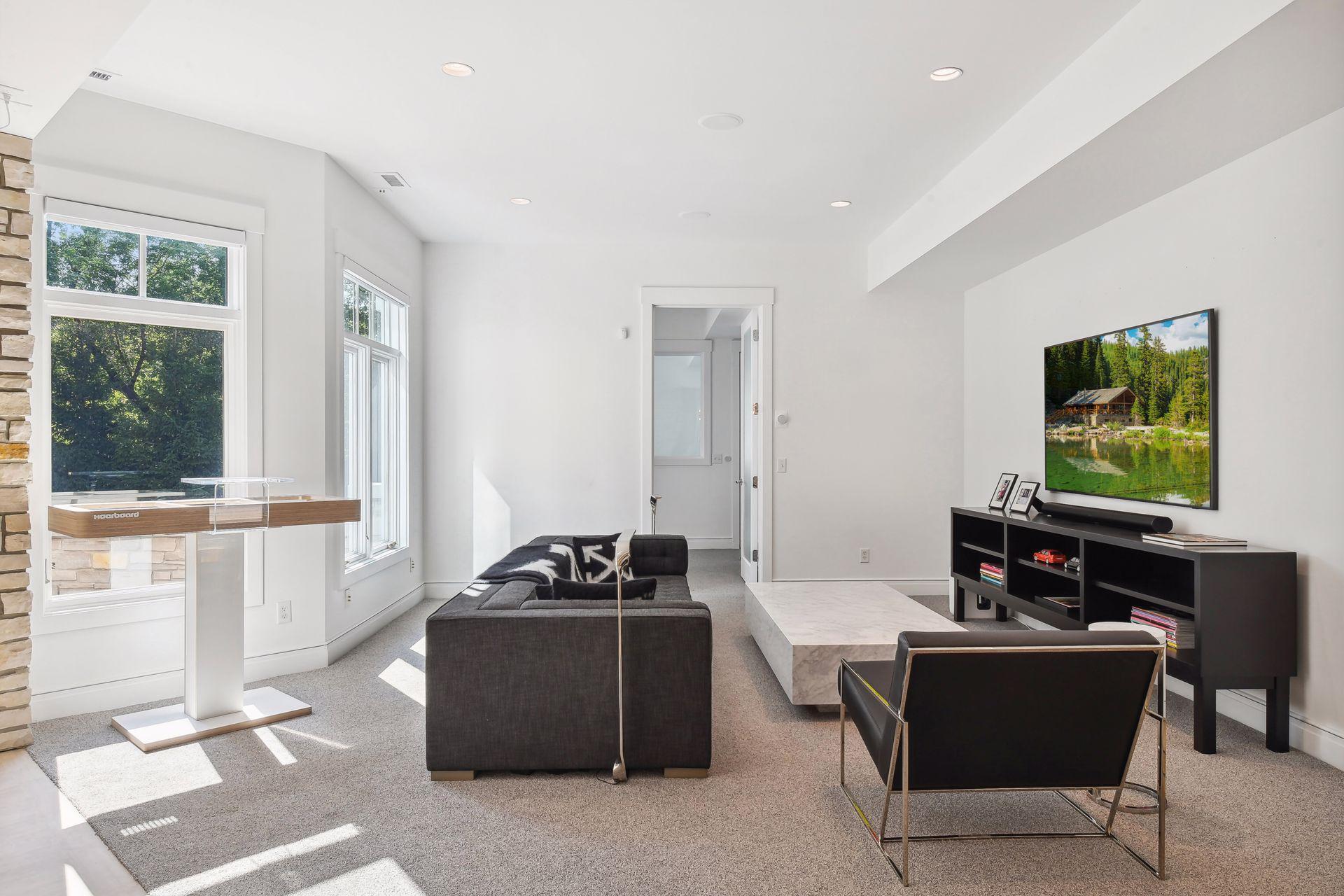 Seamless indoor-outdoor flow with walk-out access to a private, tree-lined backyard.