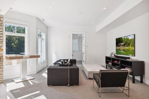 Seamless indoor-outdoor flow with walk-out access to a private, tree-lined backyard.