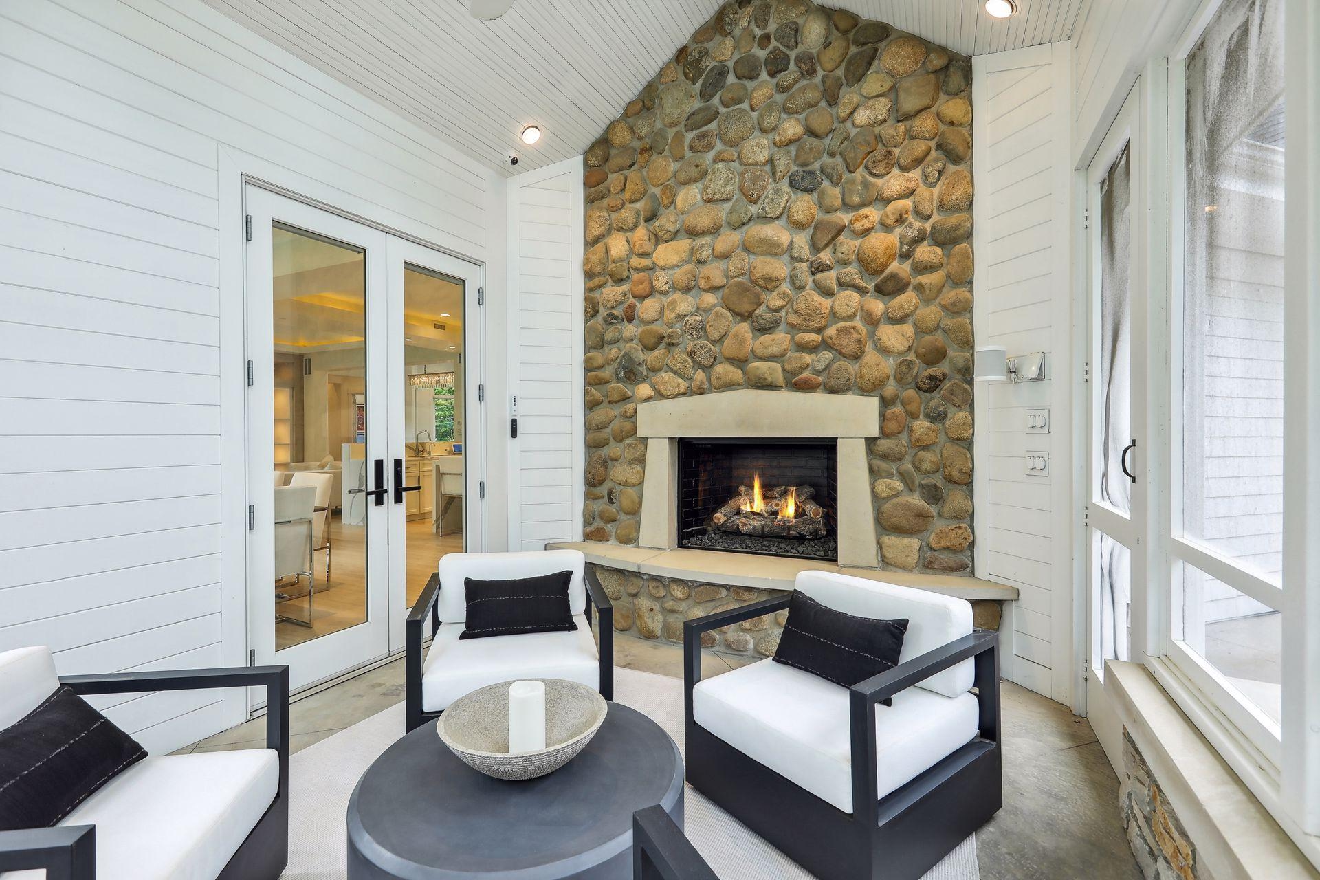 Beautiful stone surround fireplace to gather and entertain or relax