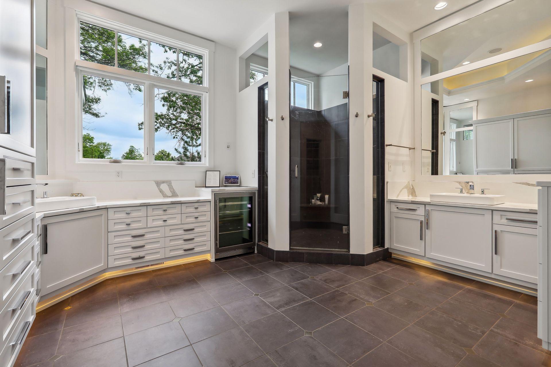 Primary bedroom en-suite bathroom with walk-in shower and tons of counter space