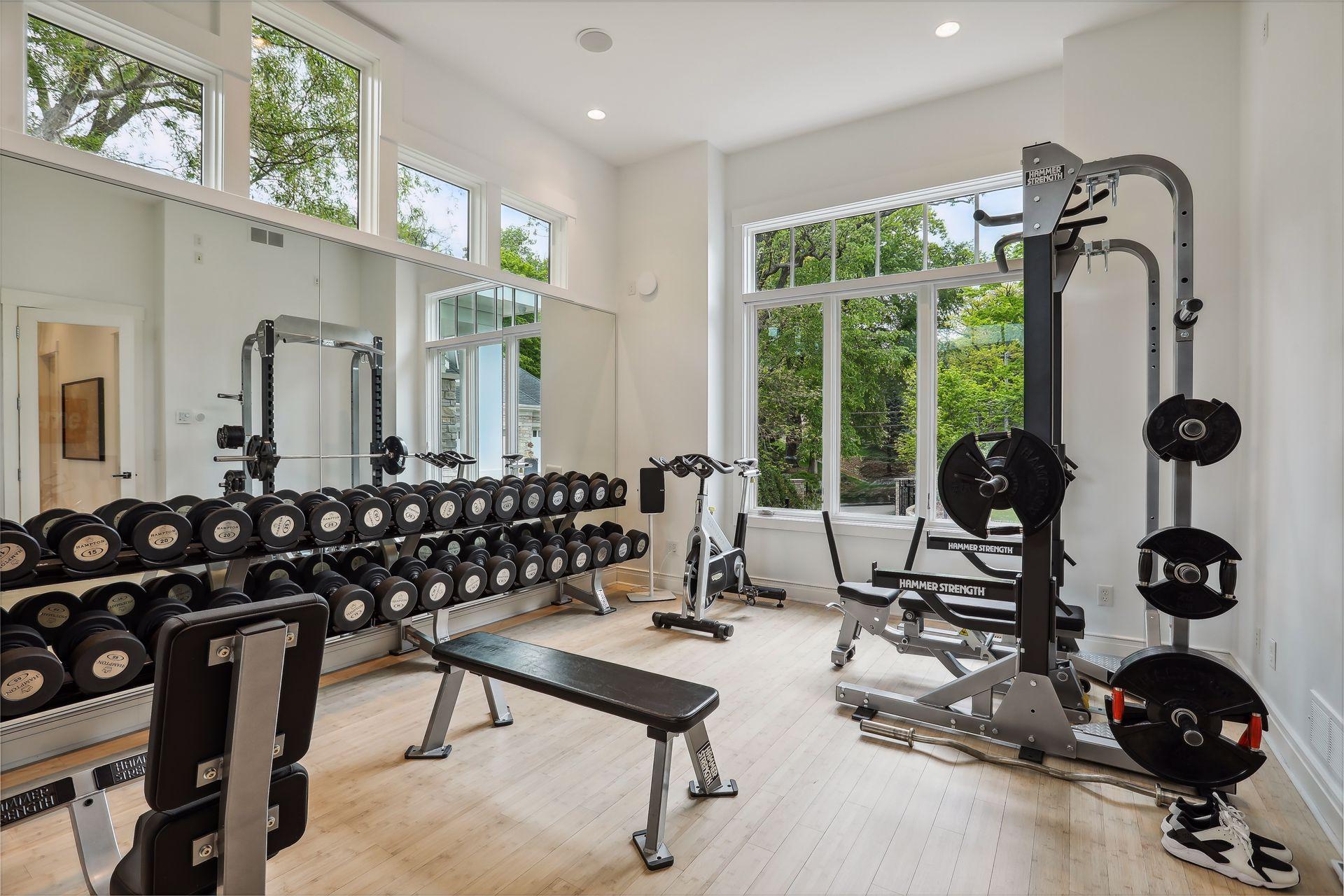Main floor exercise room with mirrored wall and plenty of room for equipment. Could be converted to an additional bedroom.