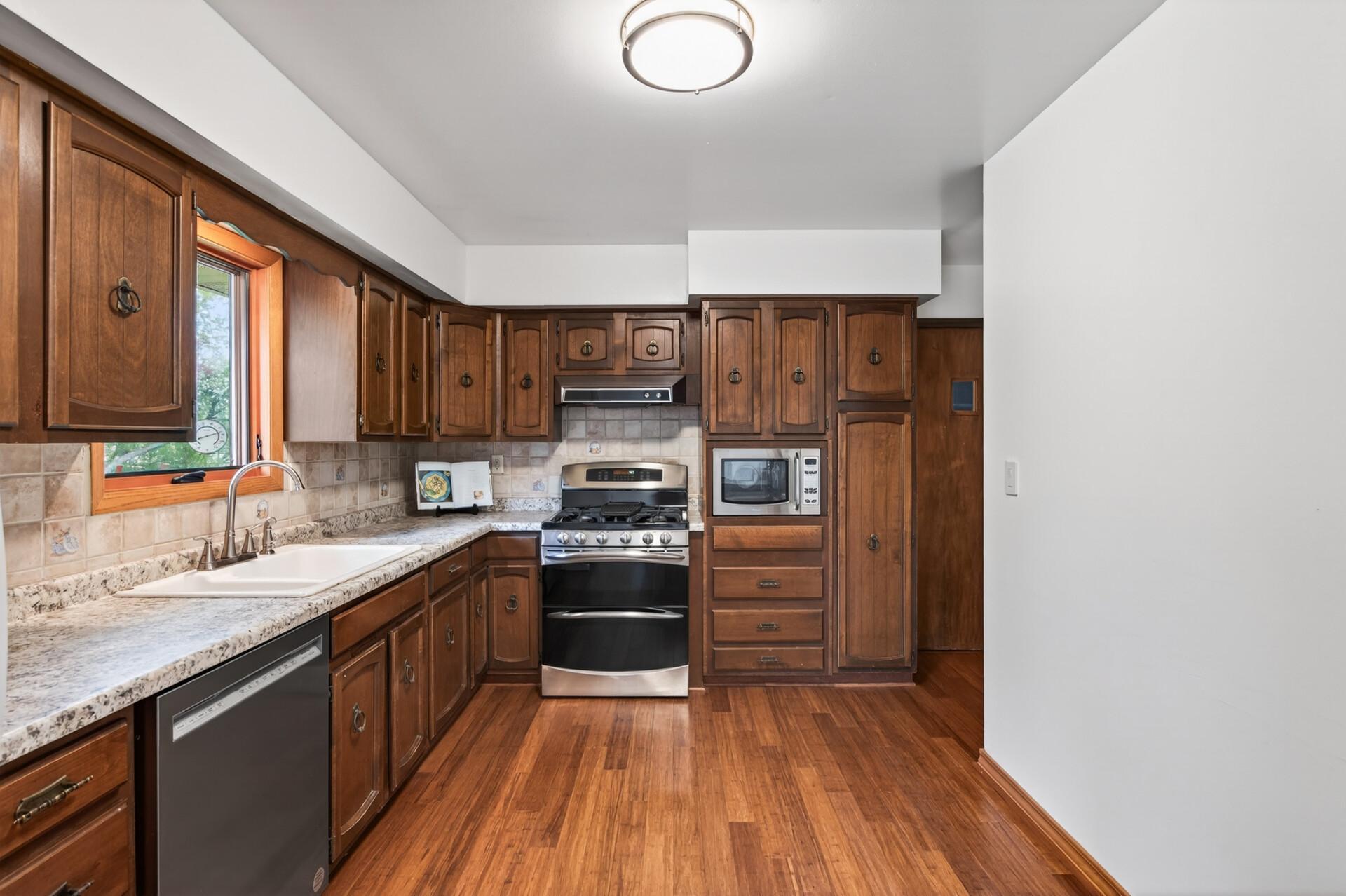 Kitchen features newer stainless steel appliances