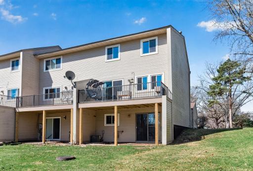 Welcome to 12293 Drake NW -Back view of Townhome, Deck off main level LR, Patio off lower level walkout