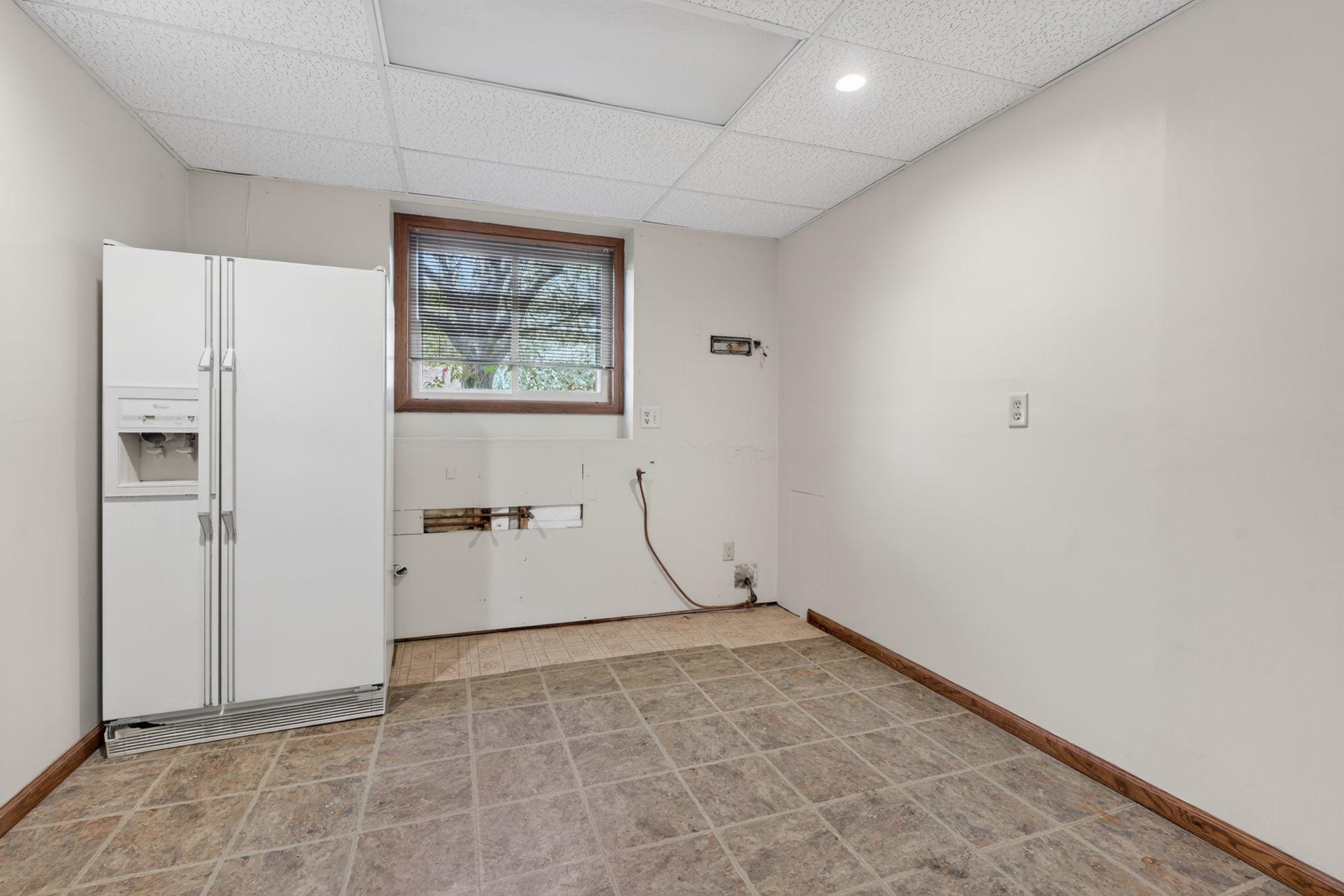 flex space ready for a 2nd kitchen, laundry, office, or add an egress window for a 5th bedroom