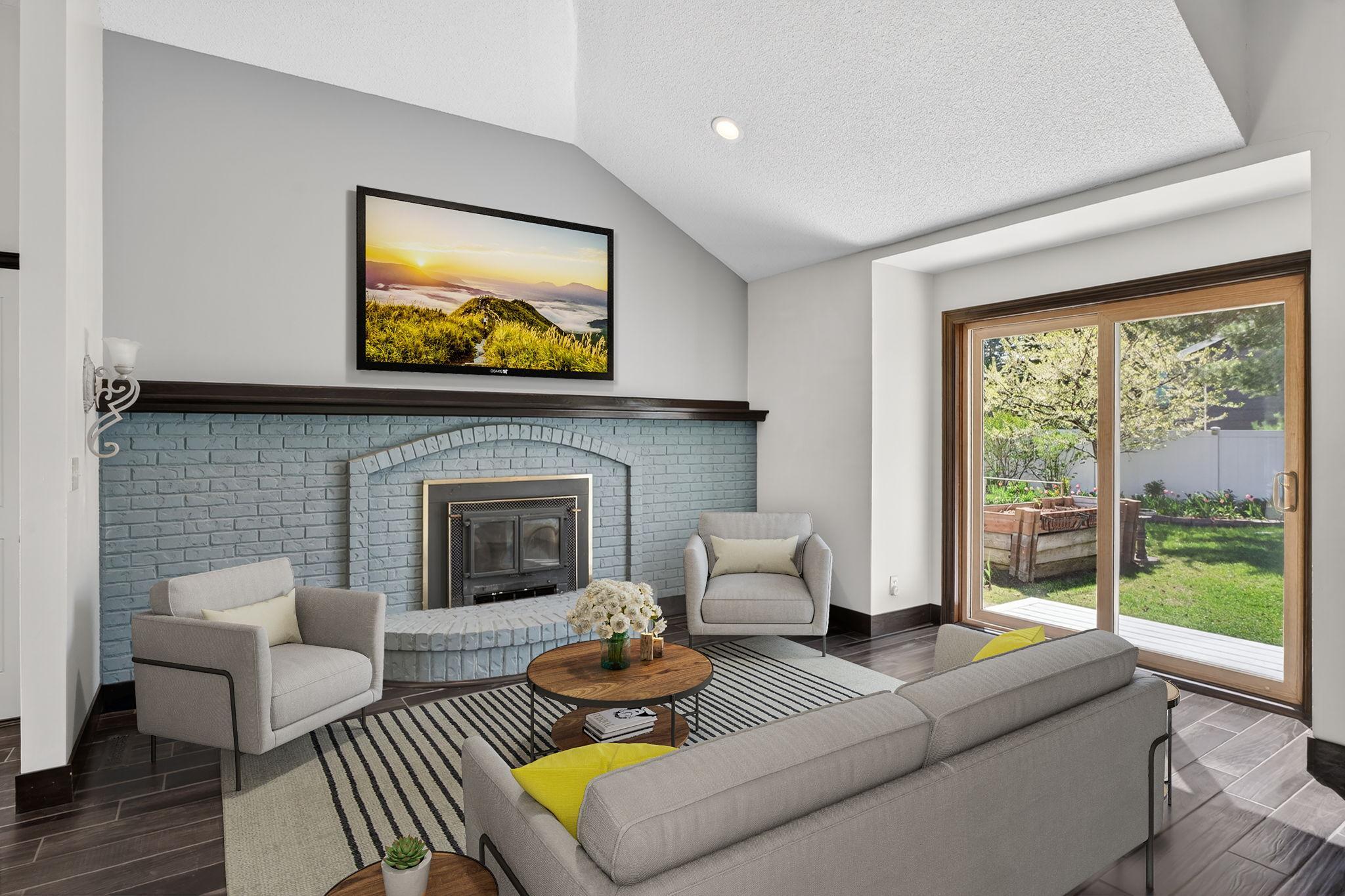 Great room with walk-out to backyard virtually staged