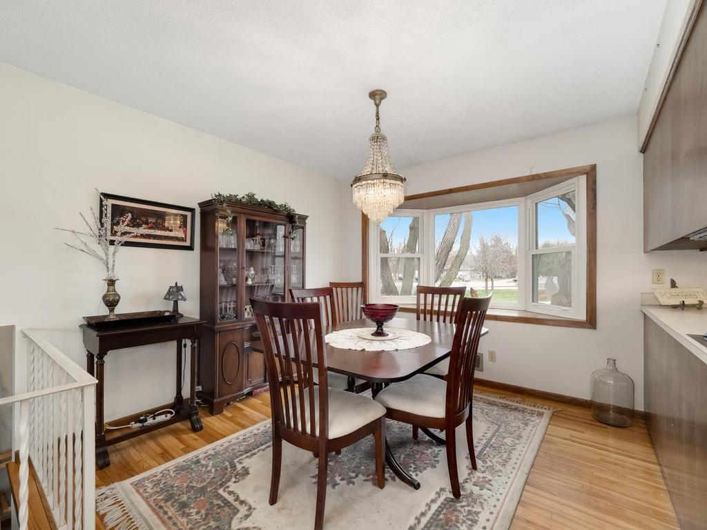 Beautiful chandelier in dining room with large newer bay window for your plants! Hardwood floor!