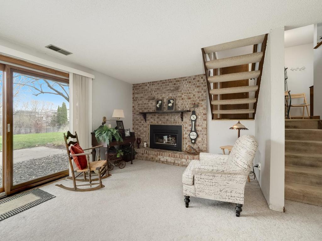 Cozy up next to gas fireplace in lower level family room this winter