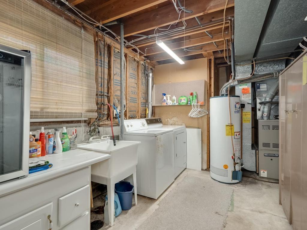Lower level laundry and furnace room. 200 amp electric main panel