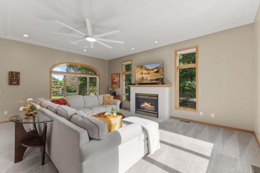 Cozy up to the gas fireplace with tile surround during the cold months