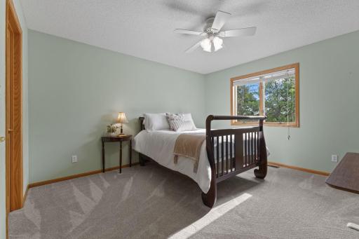 Upper level 13x12 bedroom with large walk-in closet and new carpet