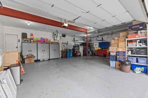 Oversized 38 x 26 insulated, heated and finished garage complete with epoxy floors, floor drain and walk up ladder to the attic. There is a whole home backup generator on the backside of the garage as well.