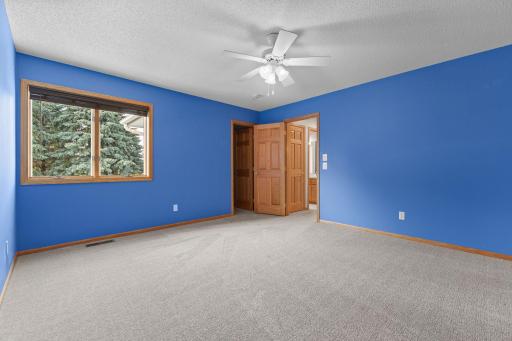 Upper level 14 x 13 bedroom with large walk-in closet and new carpet