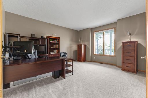 15x14 office, den or flex space with new carpet and french doors to keep the open feel of this home carrying to this room.