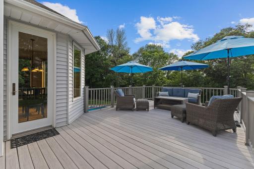 From the eat-in kitchen you have direct access to this 20x14 composite deck that overlooks the pool.