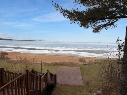200 ft of sandy beach right out your back door.