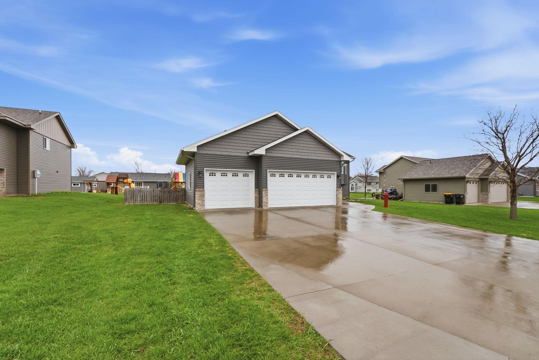 Appreciate the 3 stall garage with driveway space to accommodate multiple vehicles.