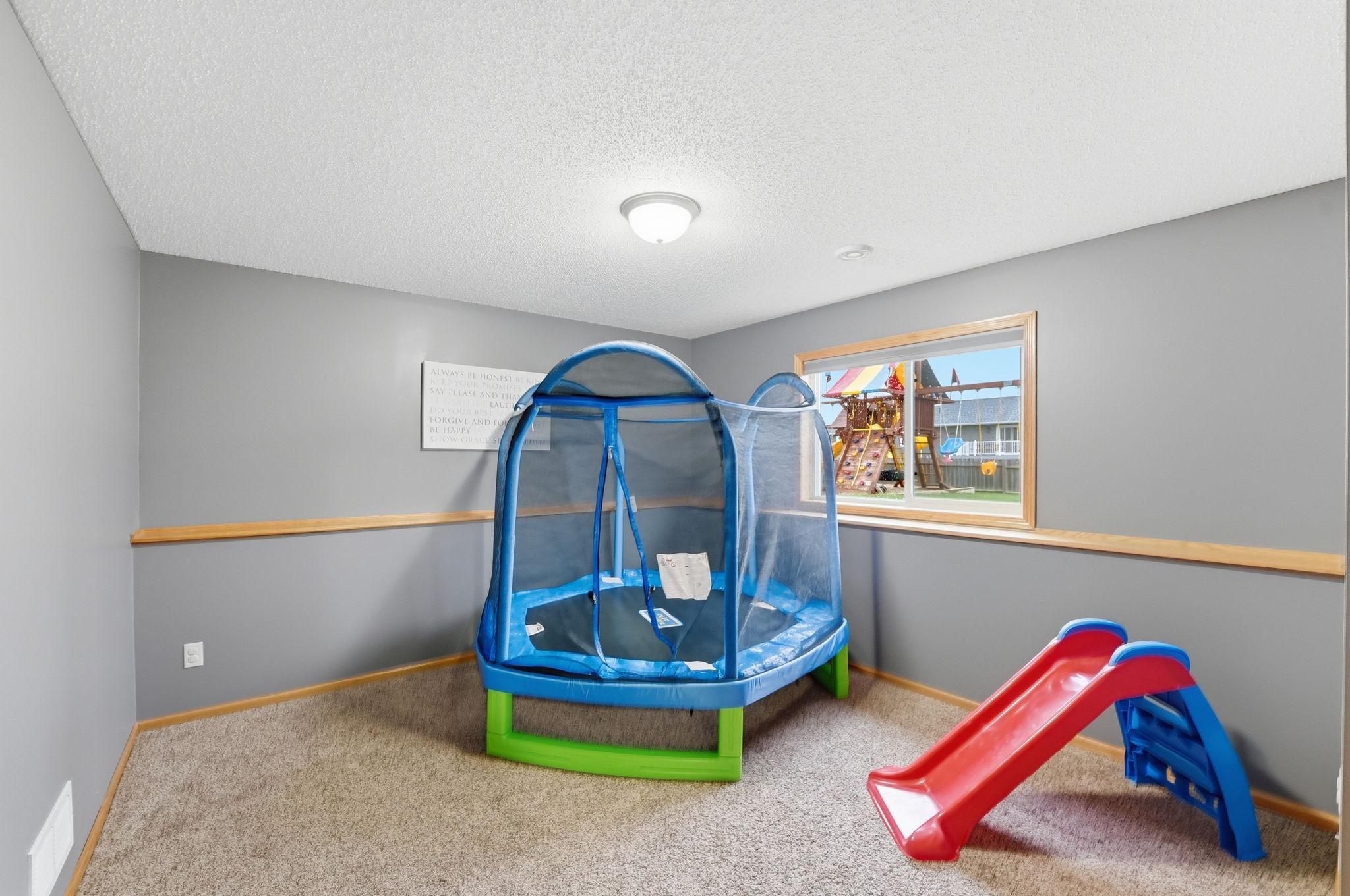 Lower-level bedroom ready for your personal touch.