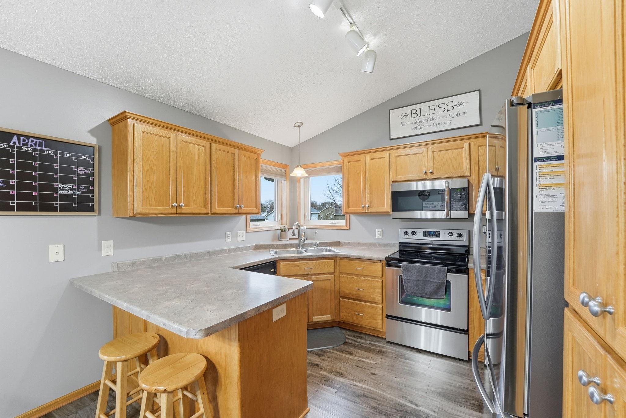 Stainless steel appliances throughout the kitchen, ample cabinetry for all your culinary needs.