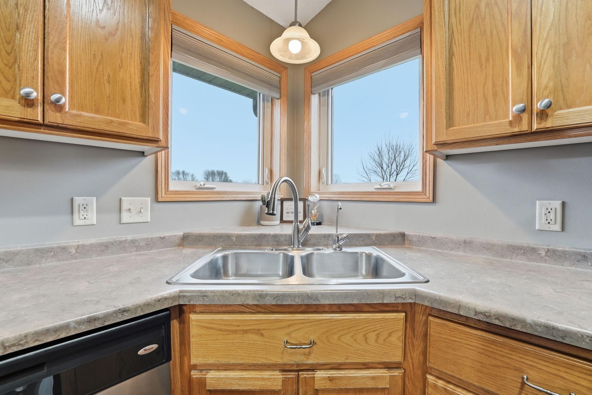 Kitchen window lookout allows natural light to flood into this space.