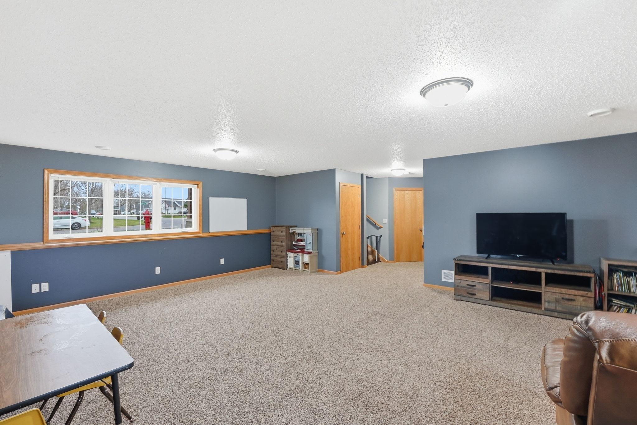 Well-appointed lower-level living area perfect for hosting guests.