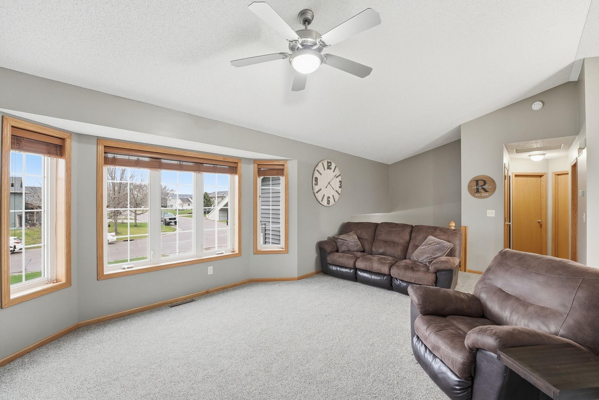 Walls of windows capture natural light and outdoor vistas.