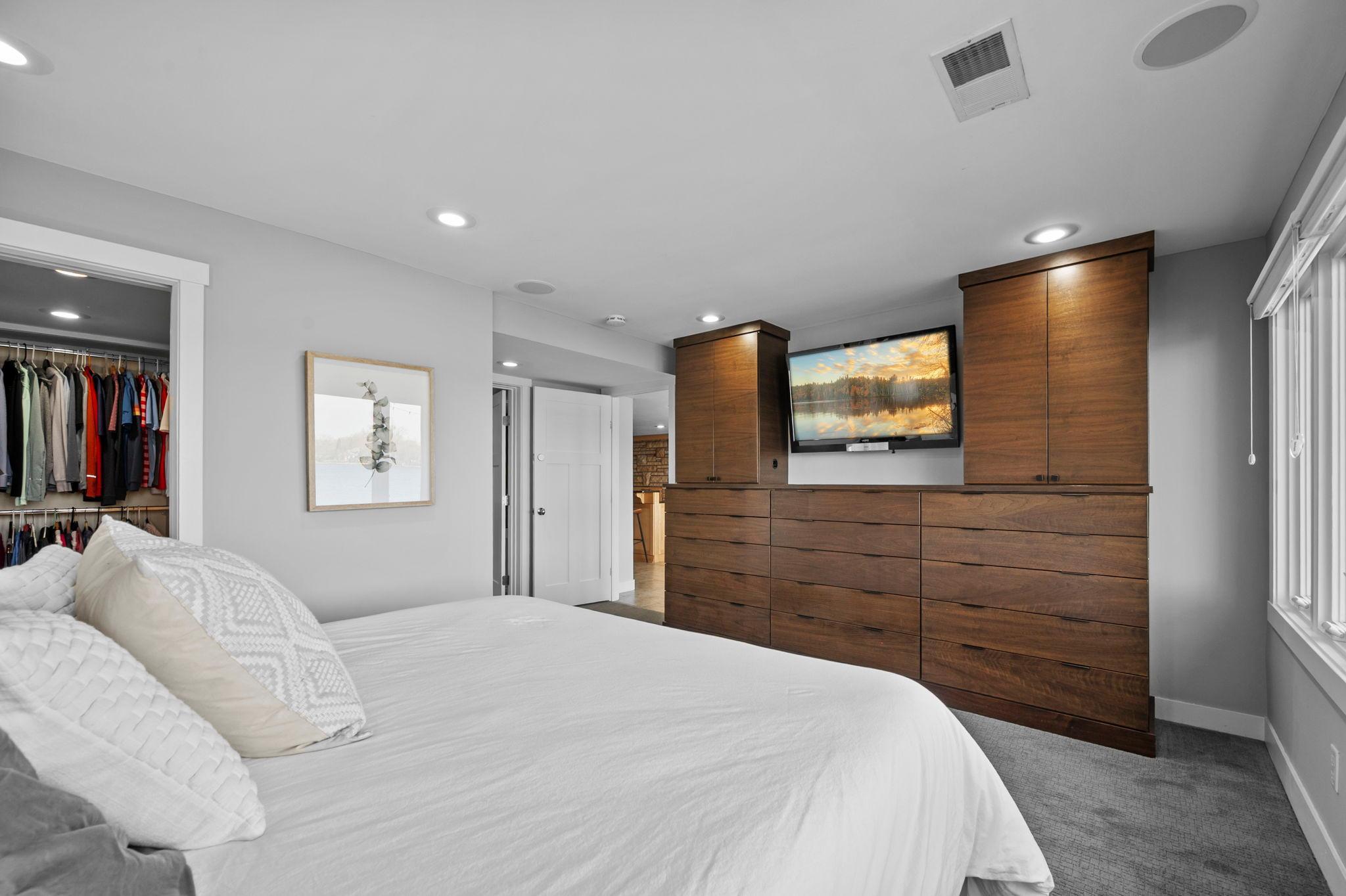 Custom built-in dresser with space for flat screen.
