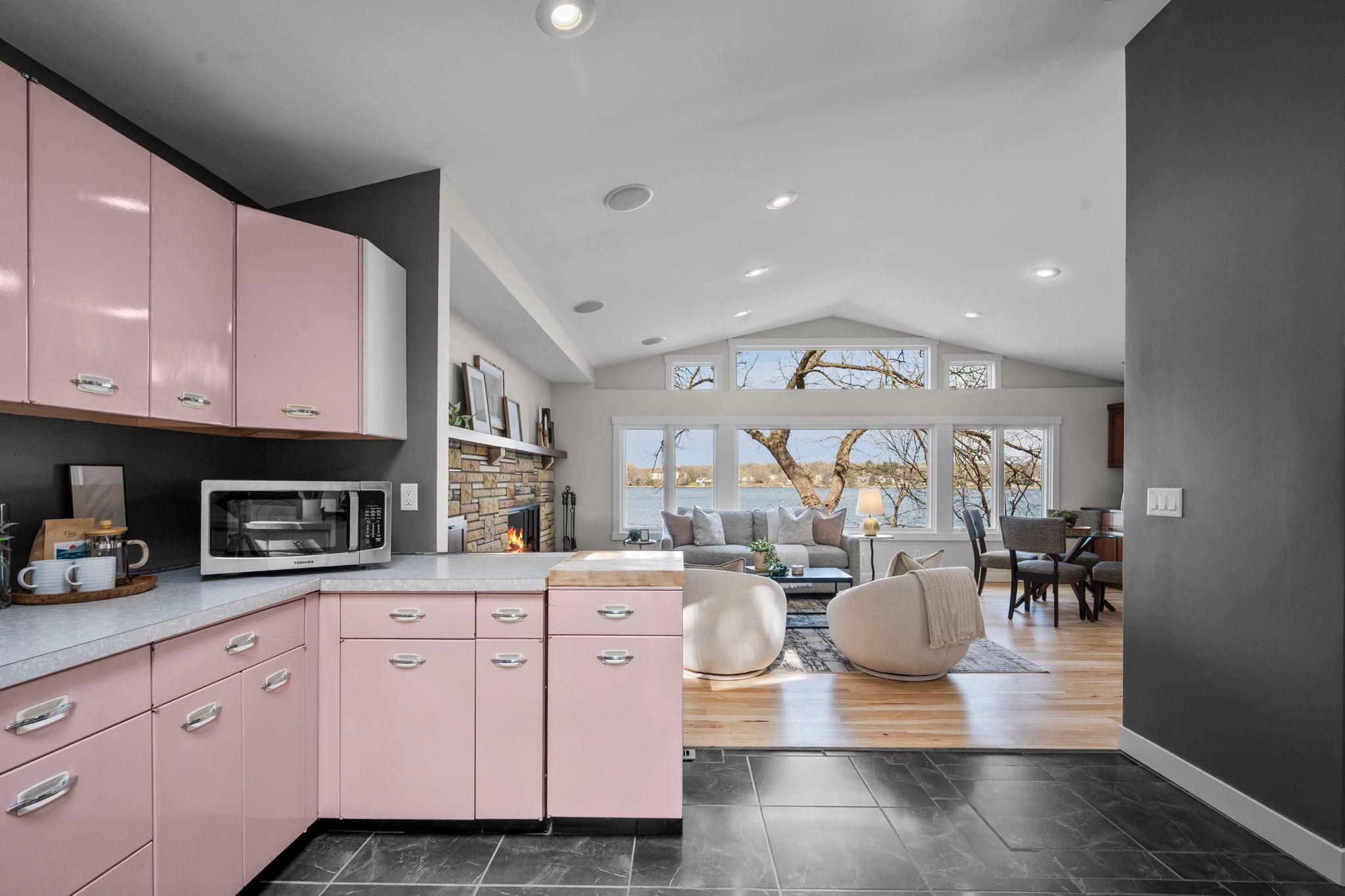 Charm exudes with this original pink metal cabinetry.