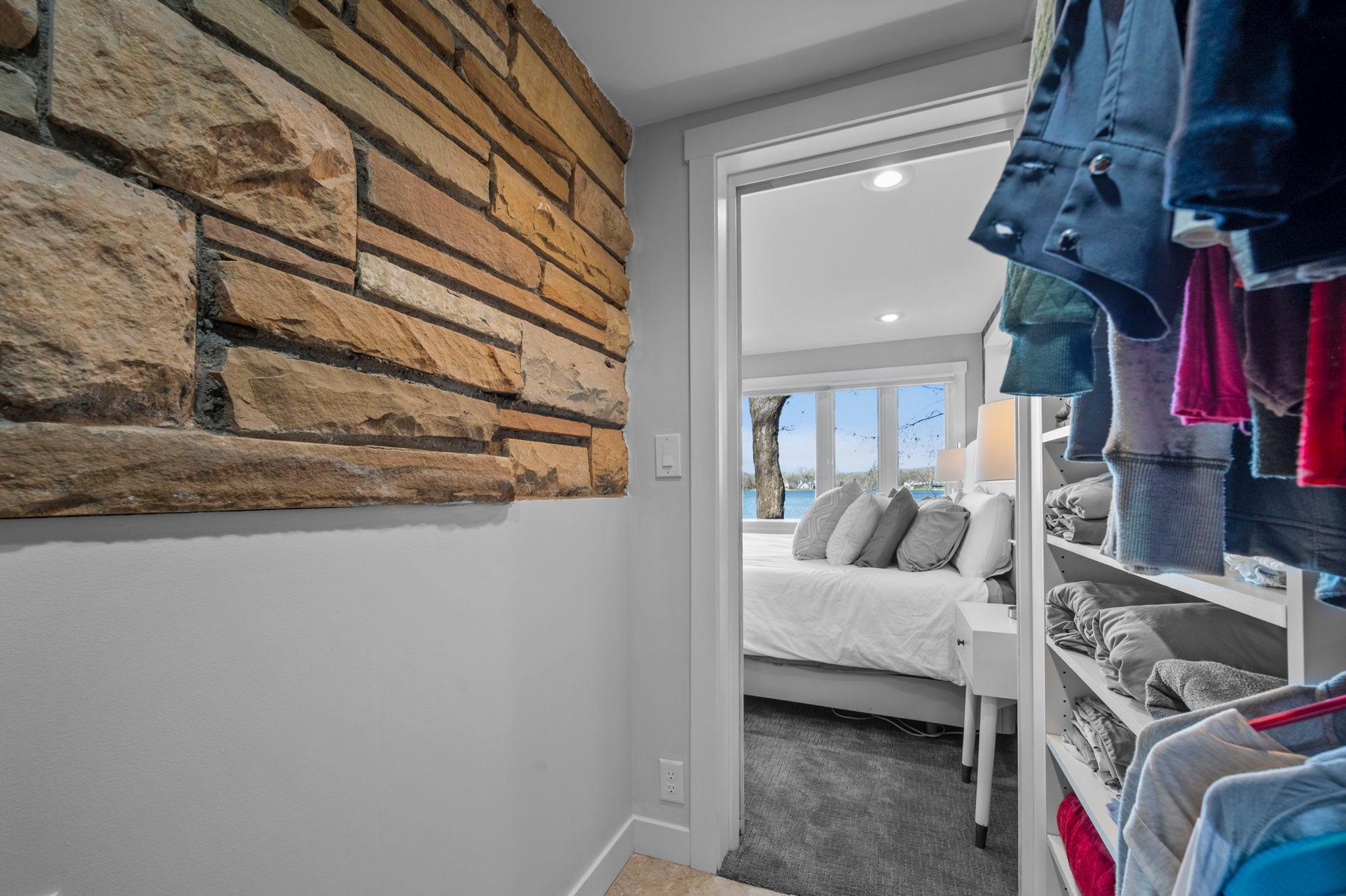 View of primary bedroom from closet.