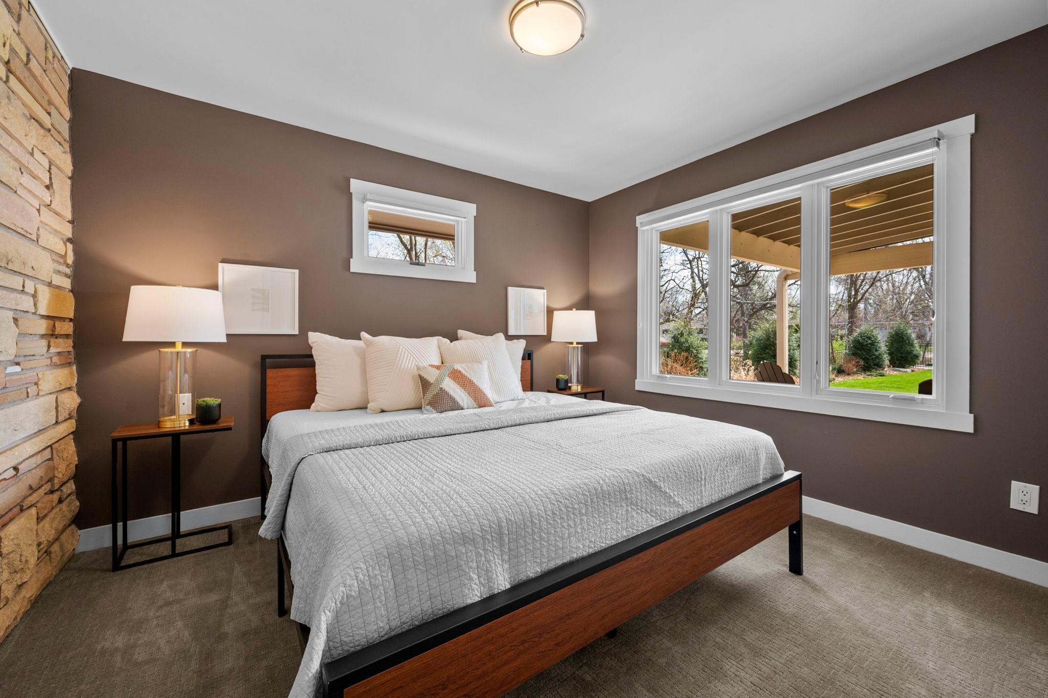 One of 2 generous sized main floor bedrooms.