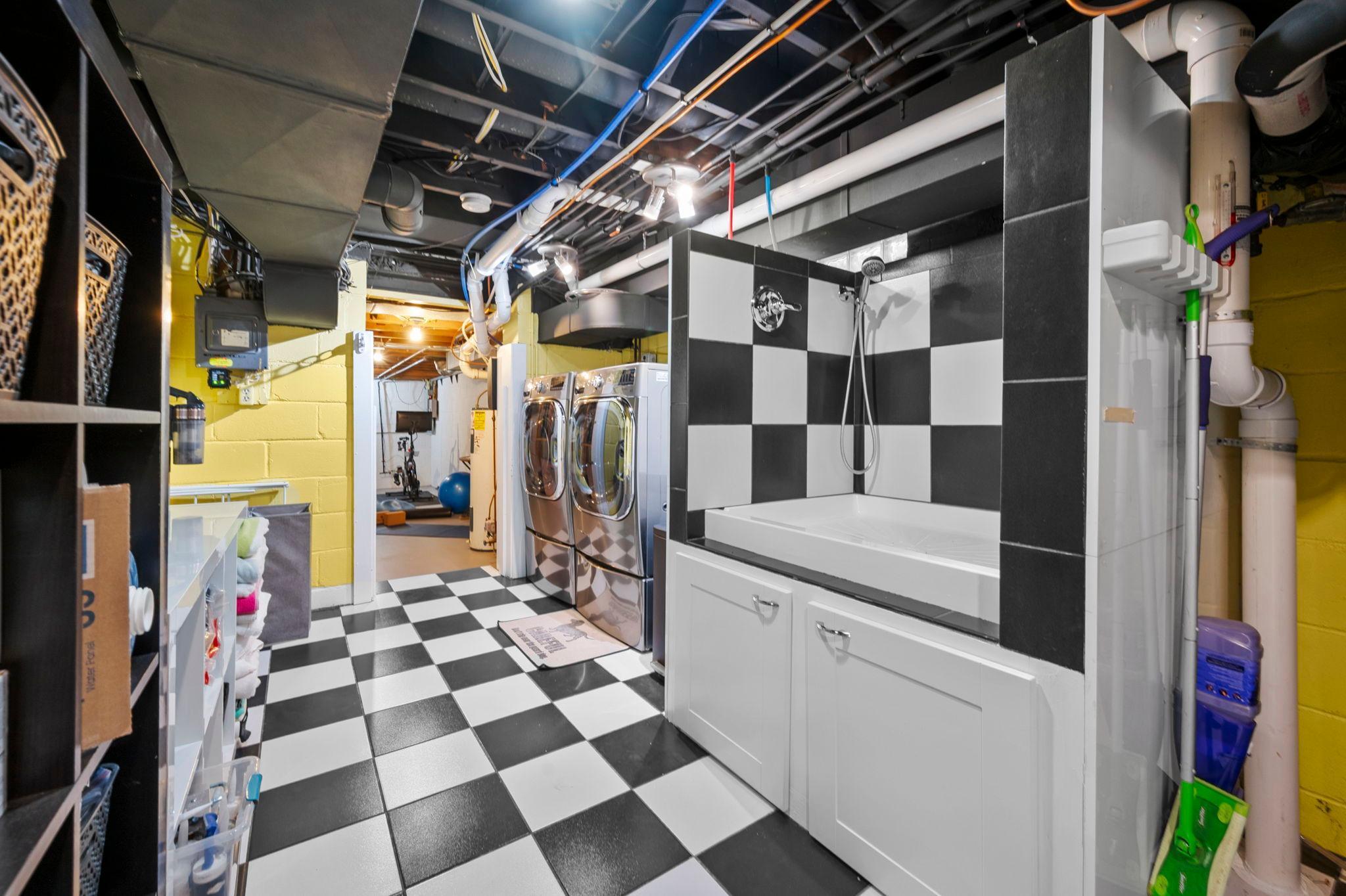 Laundry room and custom dog washing station.