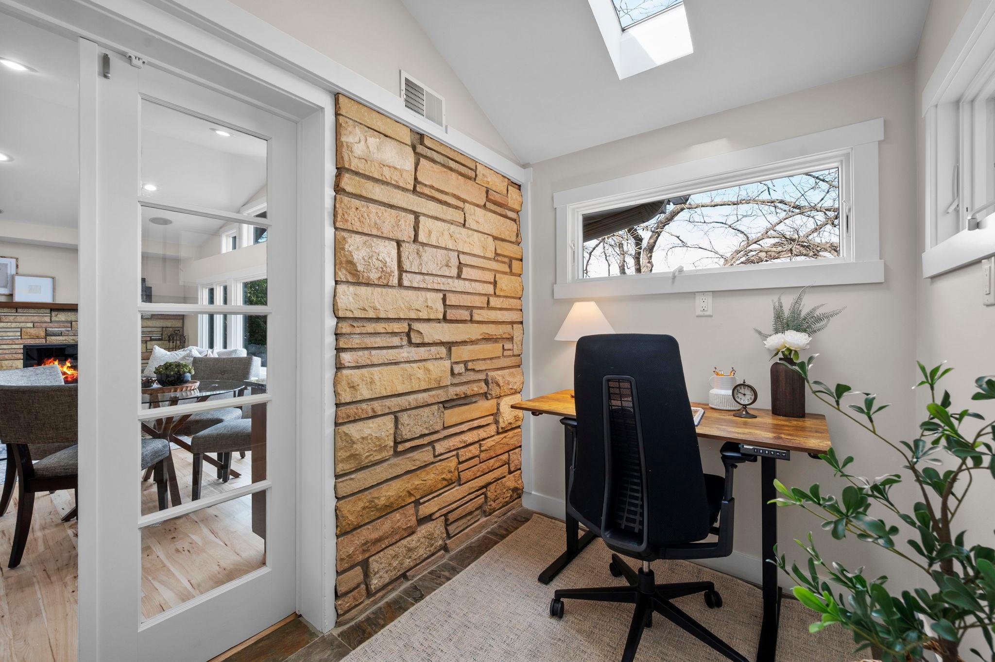 French doors lead to the charming den