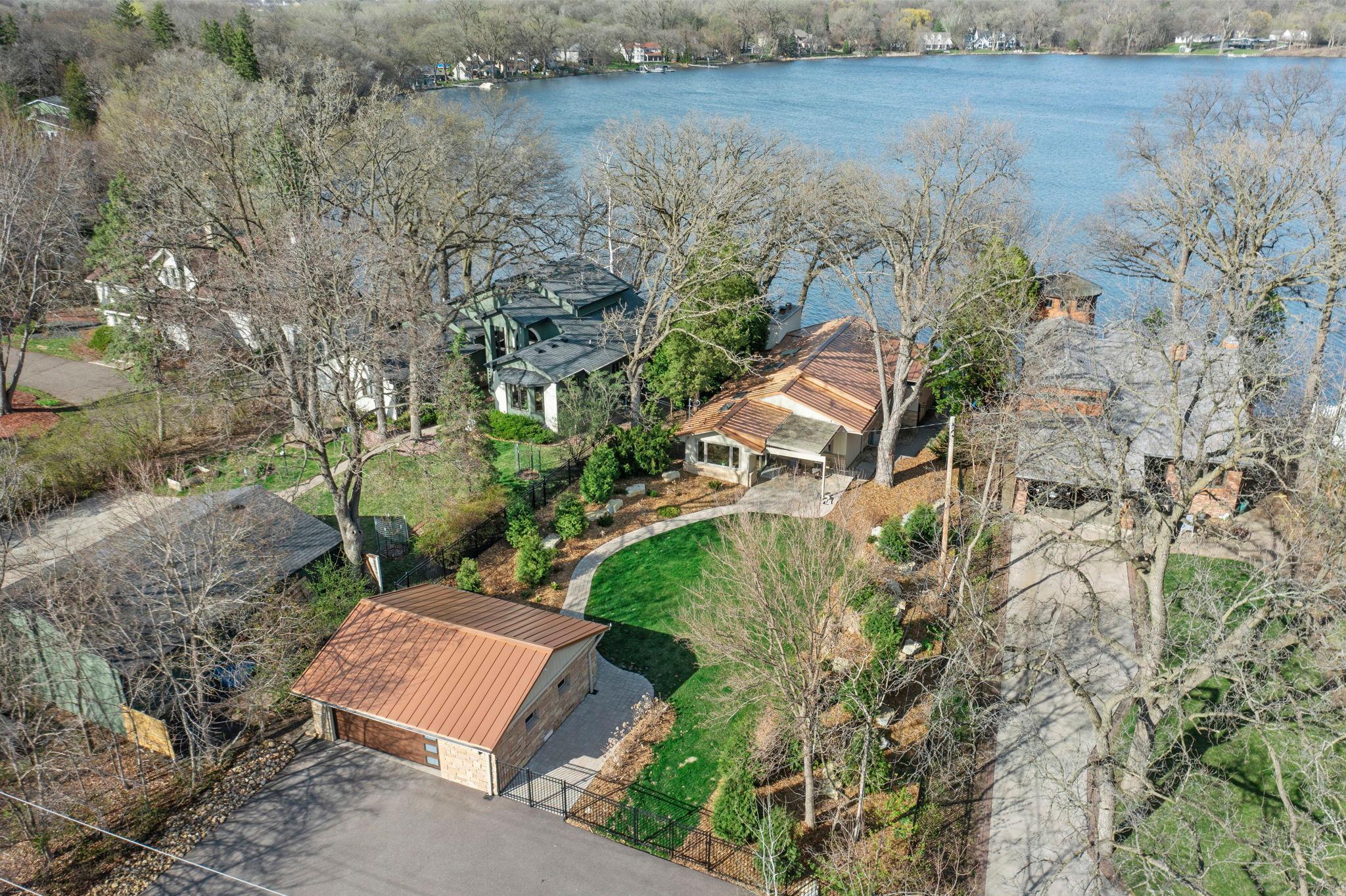 Aerial view of home and double detached garage.