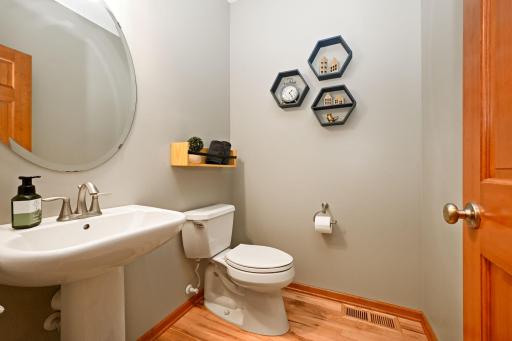 Conveniently placed powder room just off mudroom, leading to kitchen.