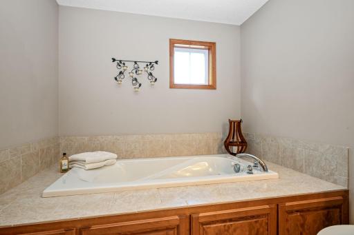 Primary bath features separate tub & shower.