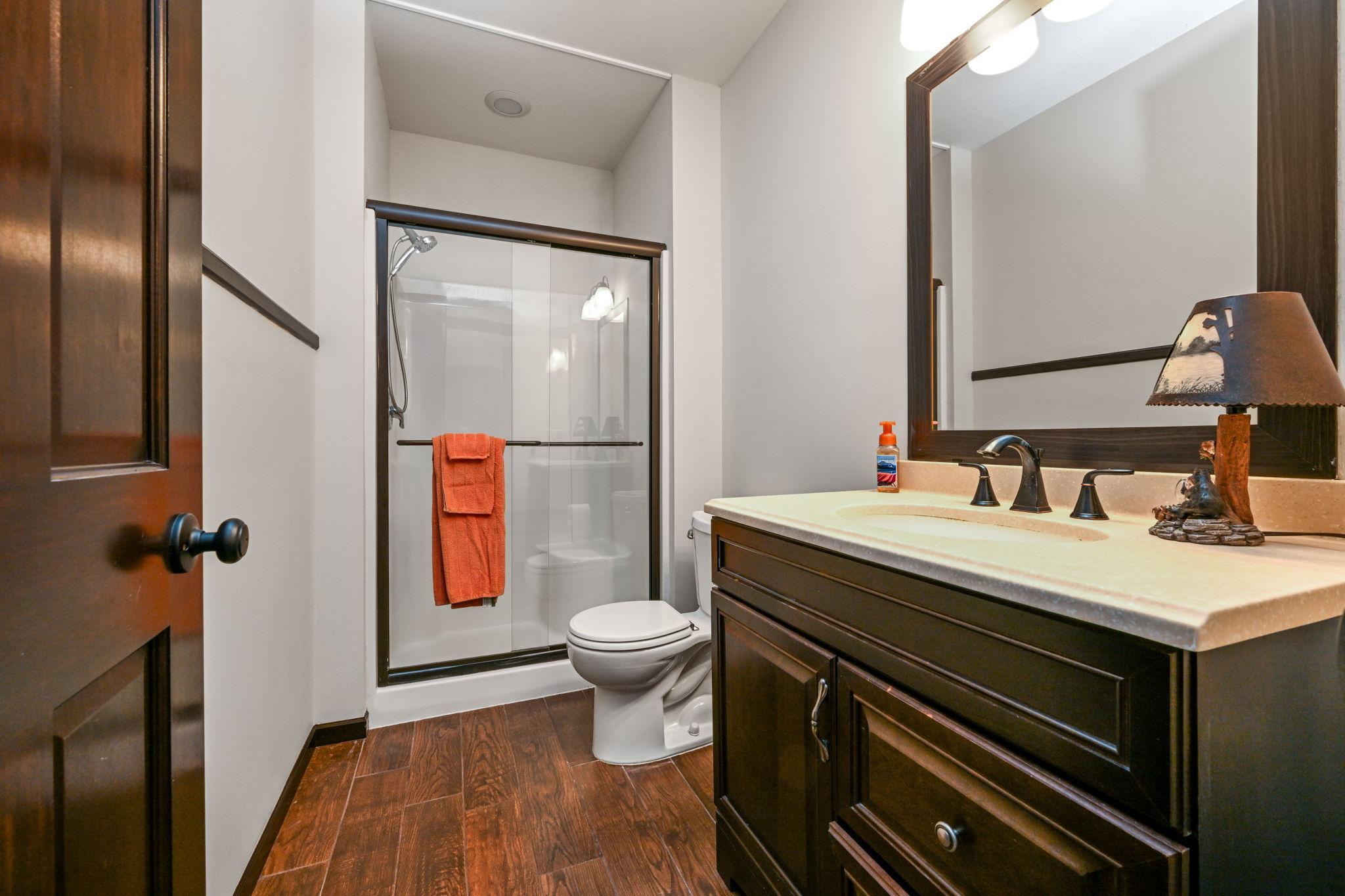 Lower level bath with shower.