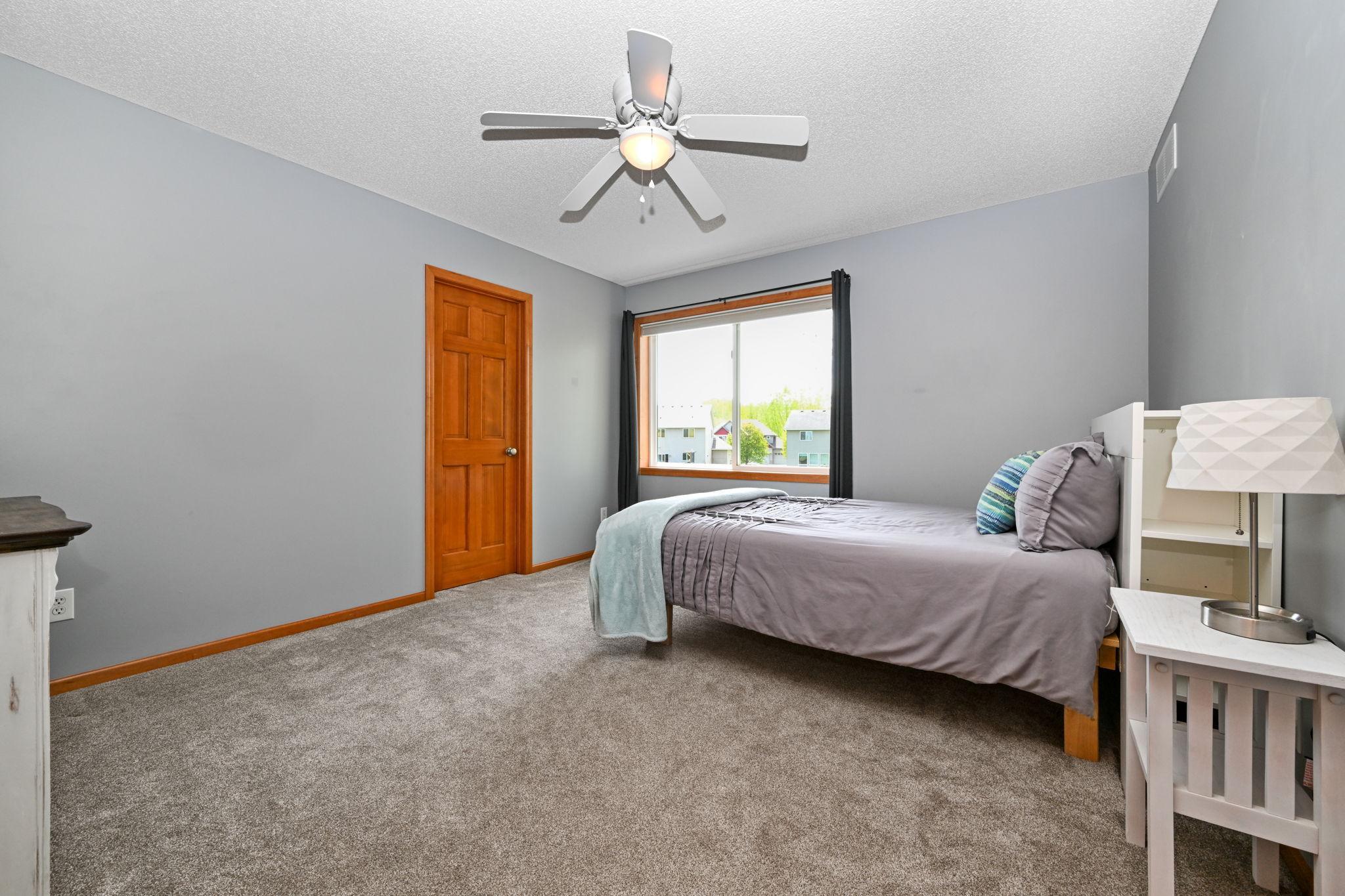 Upper level bedroom #3 with walk-in closet.