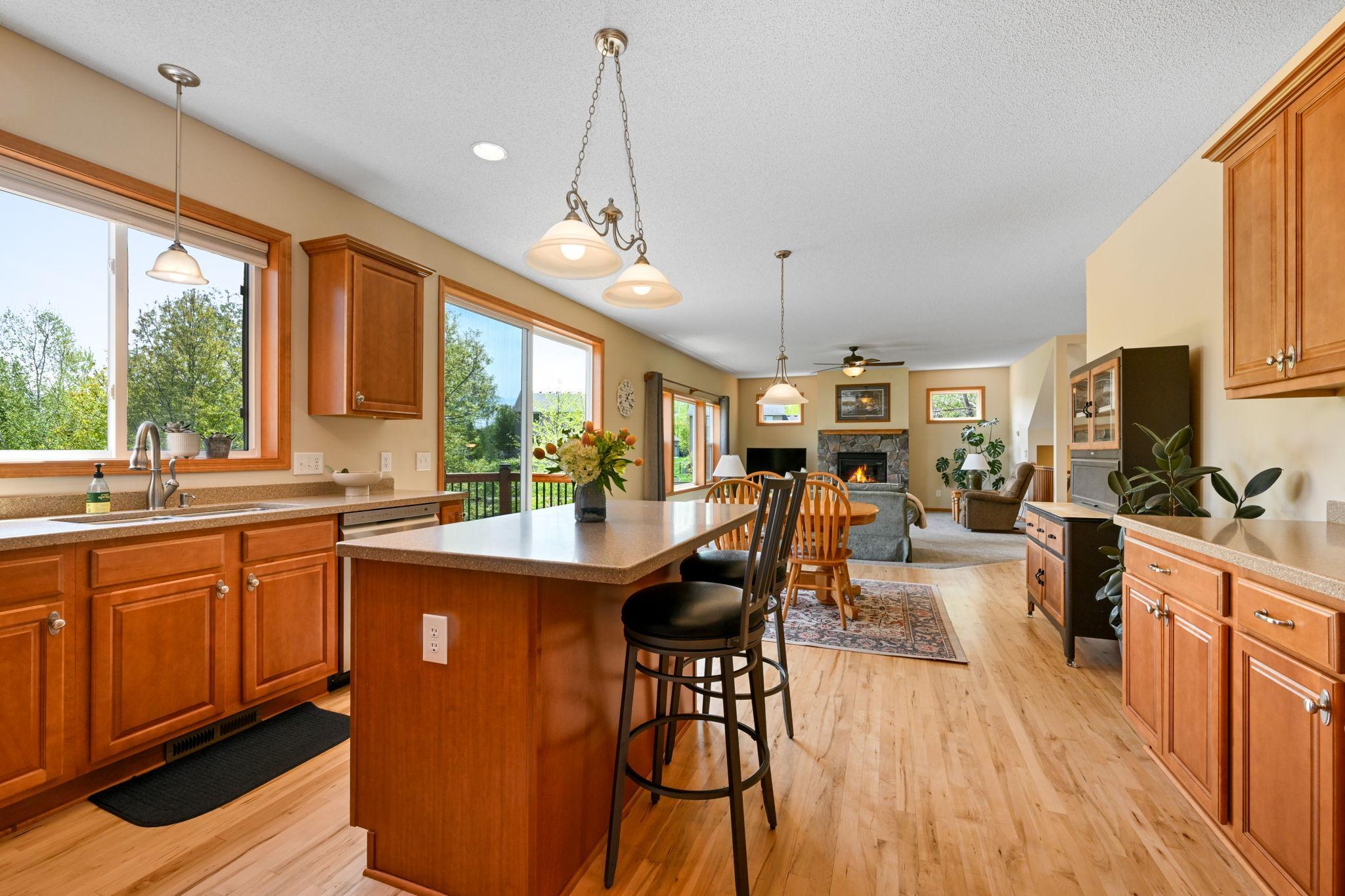 Alternate view from kitchen through to living room showcases all of the natural light.