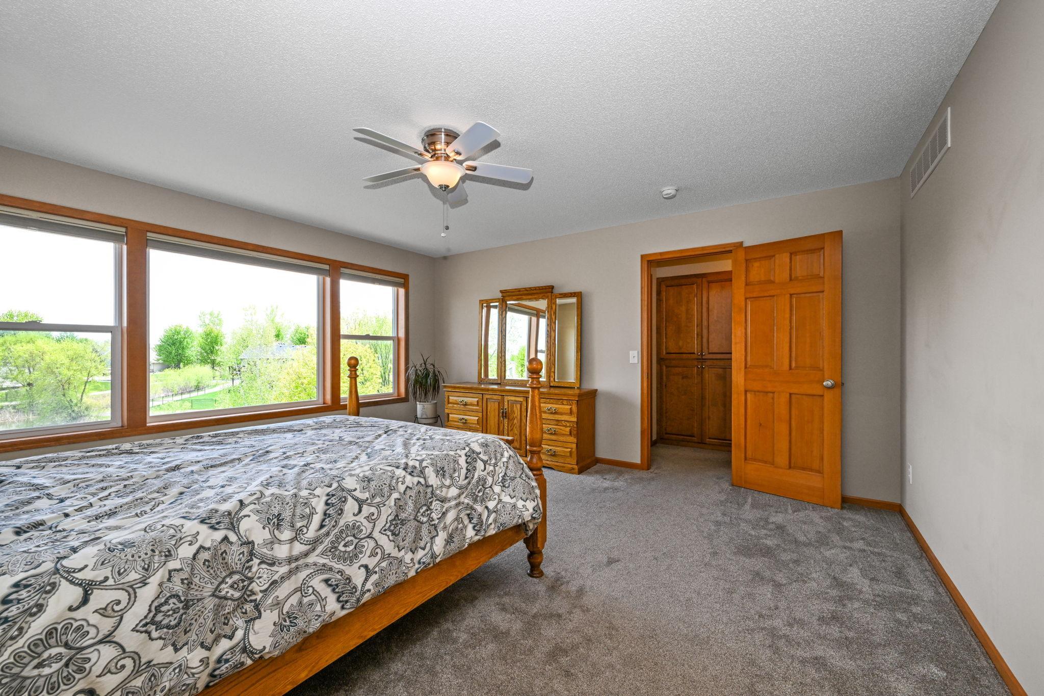 Primary suite overlooks the pond.