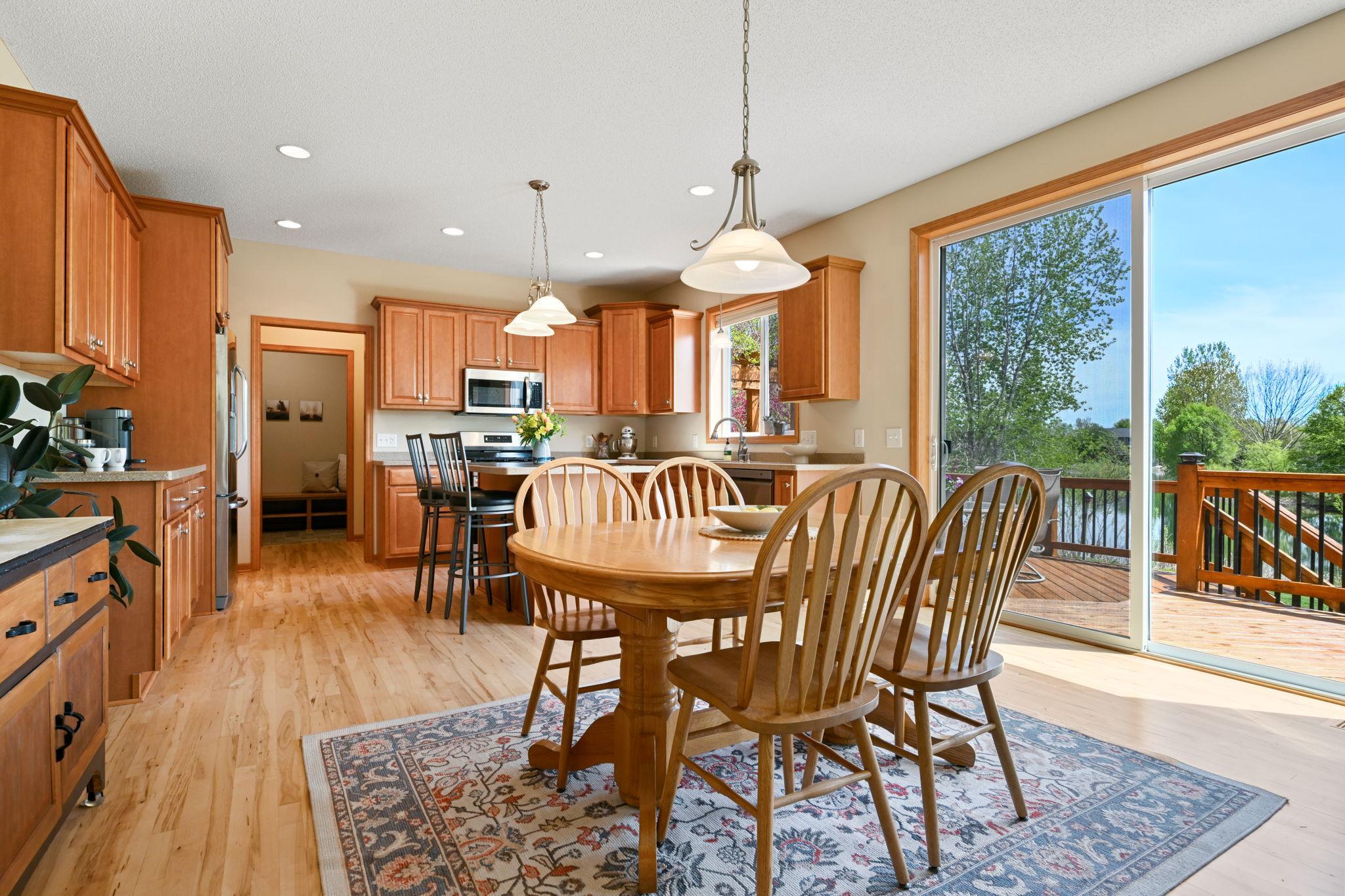 Dining area features over-sized patio doors for a picturesque view with every meal.
