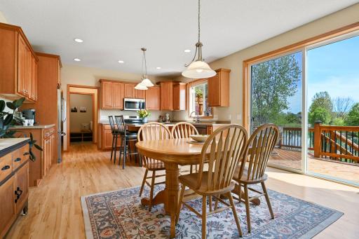 Dining area features over-sized patio doors for a picturesque view with every meal.
