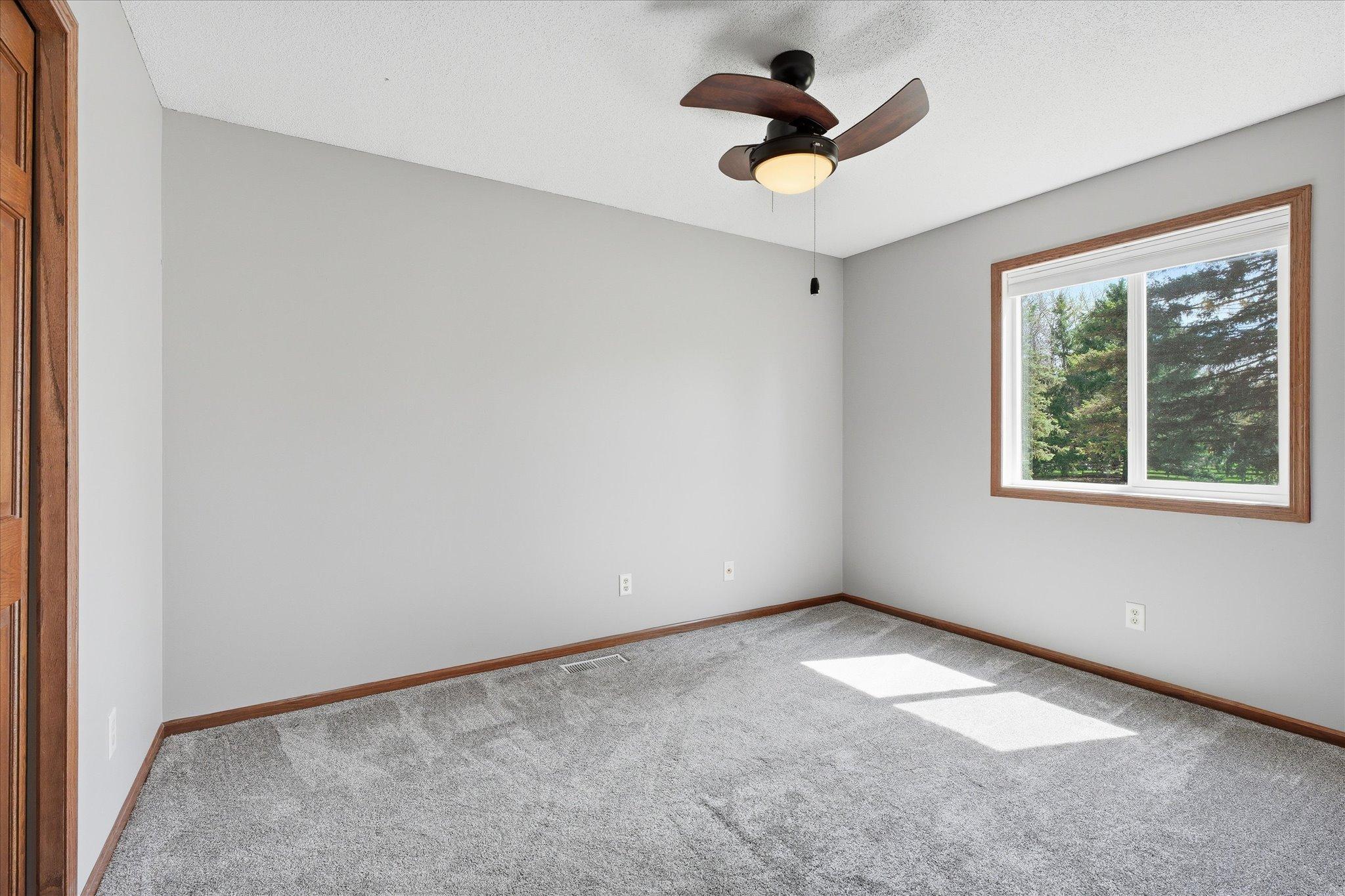 Bedroom 2 of 2 on the upper main level. This bedroom has just been painted and has newer, high end carpet.