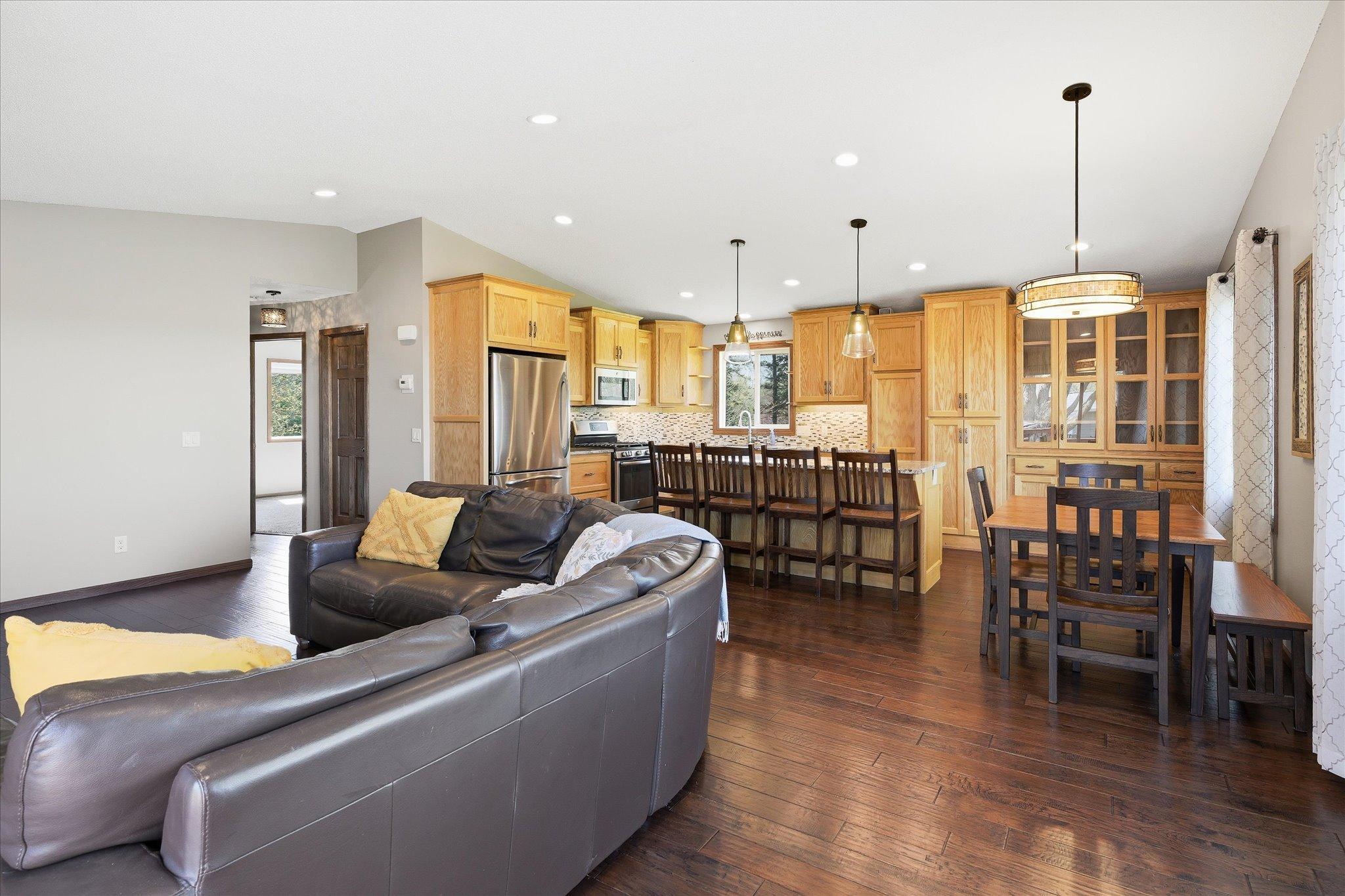 A view of the living/kitchen/dining room areas when standing by the patio door.