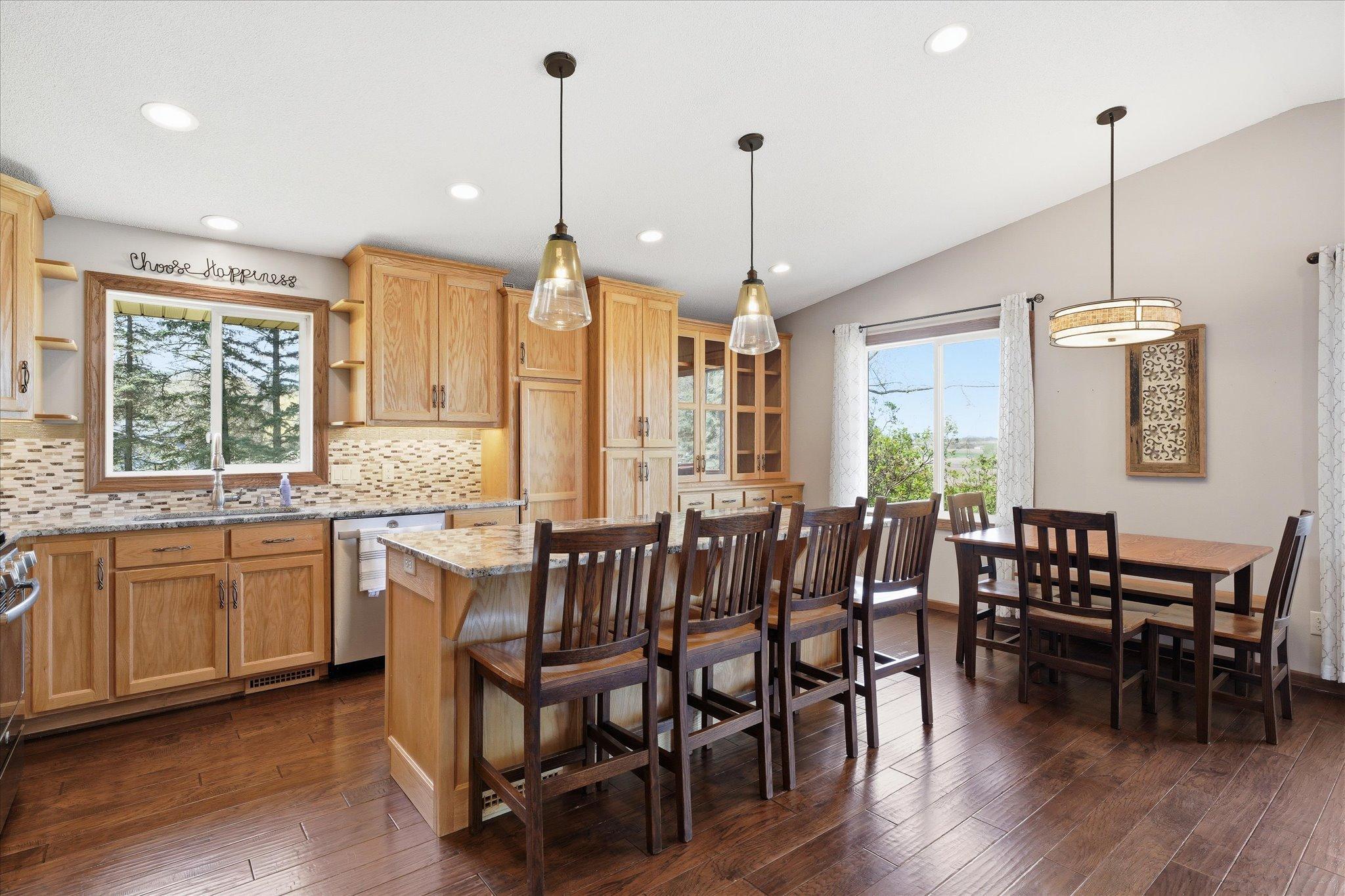 This kitchen is a cook's dream with the all the cabinetry and storage space plus large countertop area and huge center island.
