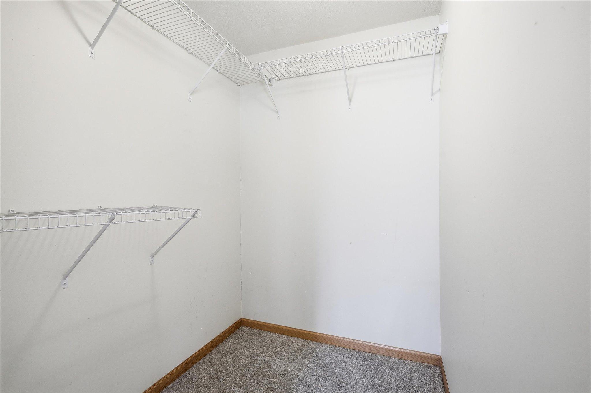 Large walk in closet in the lower level bedroom.